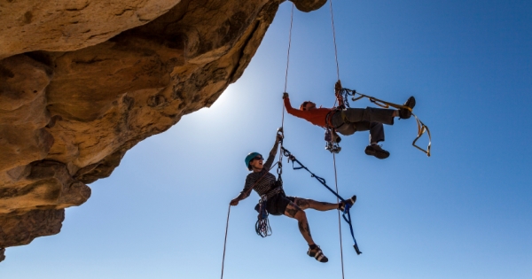 Climbing team struggles to the summit.