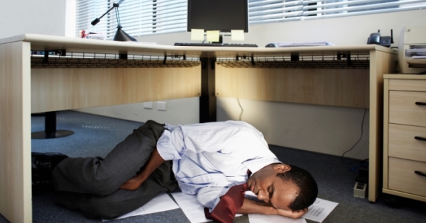Mid Adult Man Sleeping Near Documents on Floor