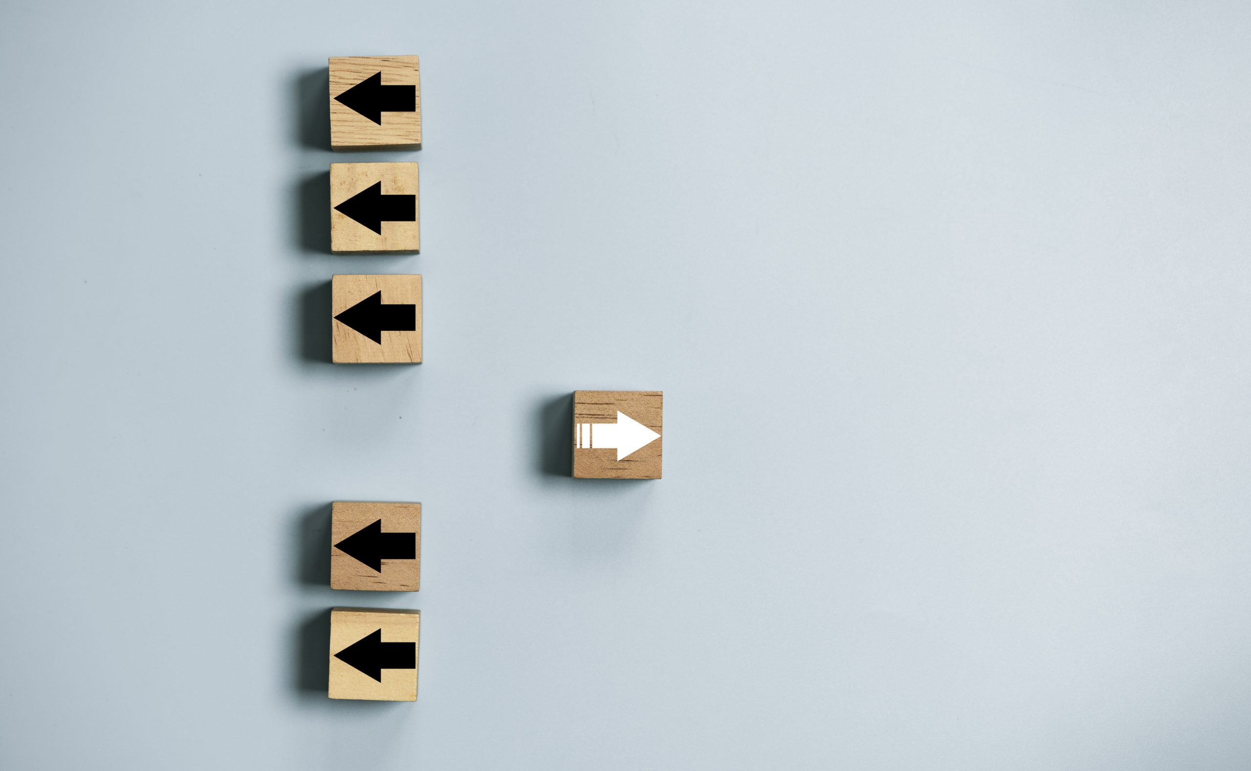 White arrow move out from different direction from many black arrow for business and technology disruption concept.